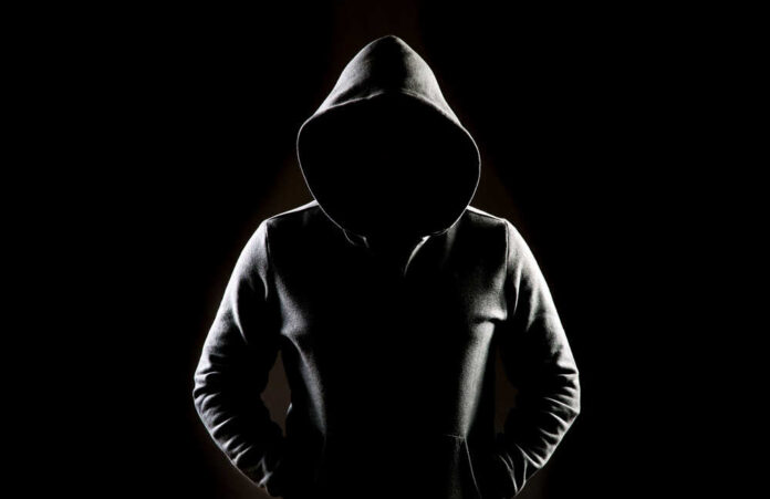 Mysterious,Man,Wit,Hoodie,In,Silhouette,Isolated,On,Black,Background