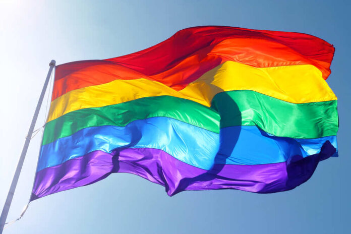 Rainbow,Flag,,Sun,,Wind,,And,Blue,Sky