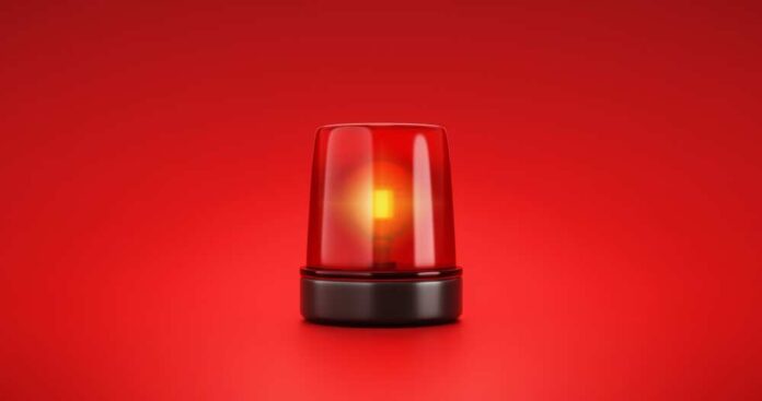 shutterstock_2053758056.jpg featured image Red emergency light on red background
