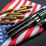 Revolver and bullets on American flag background.