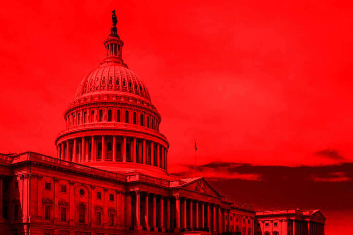 shutterstock_1142146865.jpg featured image United States Capitol building under red-tinted sky.