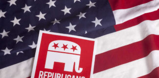 Republican party logo on American flag background.