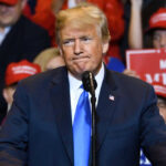 Donald Trump at a rally with supporters.