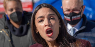 Alexandria Ocasio-Cortez speaking at an event.