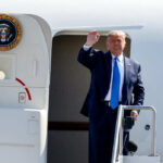 President Donald Trump stepping out of Air Force One