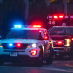 Police car and ambulance with flashing lights nighttime