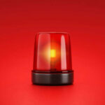 Red emergency light on red background