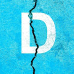 White Letter D on Cracked Blue Surface