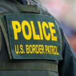Back of US Border Patrol officers vest