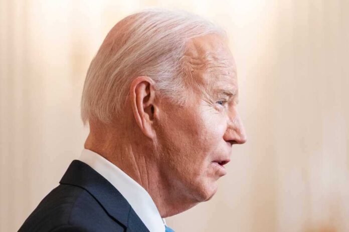 shutterstock_2425912013.jpg featured image Joe Biden in a suit speaking, facing right.