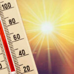 Thermometer shows high temperature under scorching sun
