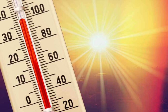 shutterstock_2452421951.jpg Thermometer shows high temperature under scorching sun