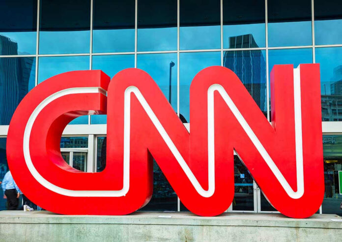 Red CNN logo outside a building entrance