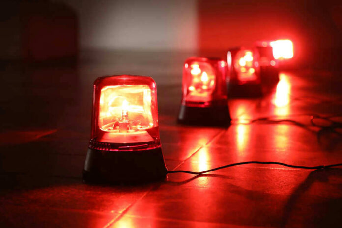 Red emergency lights on dark floor illuminating the area
