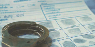 Handcuffs on a fingerprint document