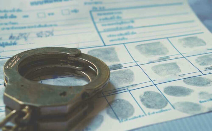 Handcuffs on a fingerprint document