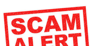 Red stamp with the words 'SCAM ALERT' in bold letters