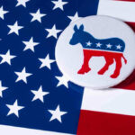 Democrat donkey button on American flag background