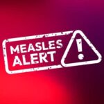 Measles alert warning sign with exclamation mark