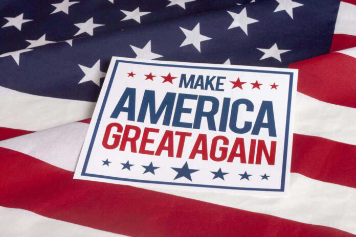 Sign saying Make America Great Again on American flag