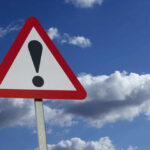 Shocking Accident: 2 Dead, 7 Children Hurt (Video) Warning sign with exclamation mark against sky
