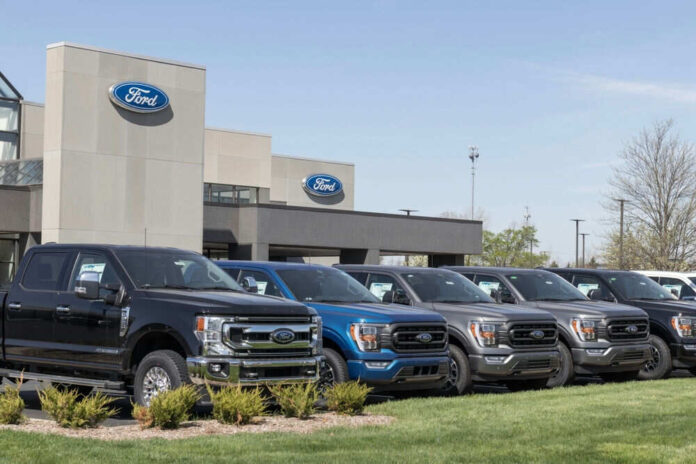 Ford dealership with trucks lined up outside