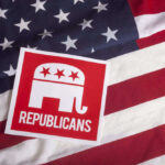 Republican party logo on American flag background.