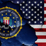 Shock Exit Rocks FBI FBI seal superimposed on cracked American flag.