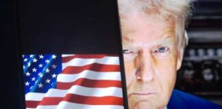 Close-up of a political figure with an American flag in the background