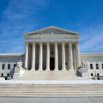UNEXPECTED Supreme Court Loss Stuns Trump Team U.S. Supreme Court building under clear blue sky.