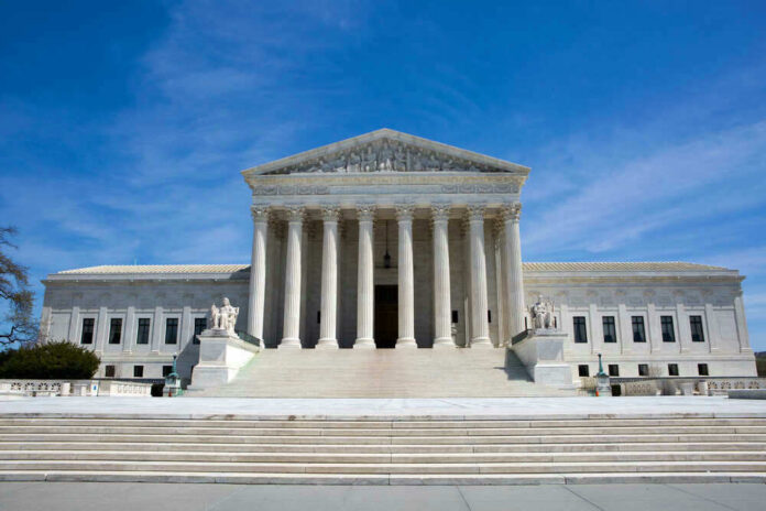 shutterstock_529928383.jpg U.S. Supreme Court building under clear blue sky.