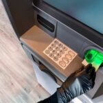 Person using an ATM to insert a card