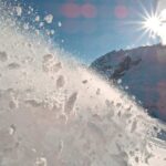 VIDEO: Huge Avalanches Kill 5 Snow spraying from a slope under a bright sun