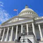 US Capitol building with American flag and columns