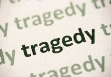 Instant Deaths Rock Hockey League Close-up of the word 'tragedy' printed multiple times in varying shades