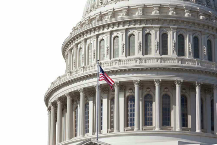 shutterstock_2082475843.jpg U.S. Capitol dome with American flag flying.