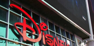 Disney sign on building with Mickey Mouse figure