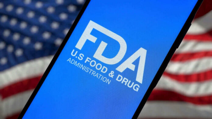 shutterstock_2593746281.jpg FDA logo on smartphone American flag background