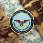 Department of War insignia on camouflage fabric