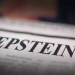 Close-up of a newspaper headline reading 'EPSTEIN'