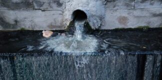 Water flowing from a pipe into a basin