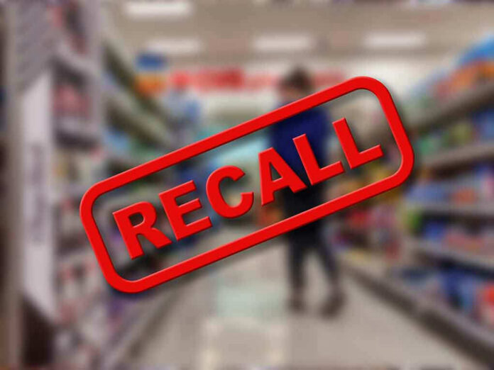 2187841613 Recall stamp on blurred store aisle background.