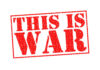 A bold red stamp with the text 'THIS IS WAR'