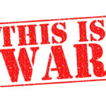 A bold red stamp with the text 'THIS IS WAR'