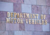 Sign for the Department of Motor Vehicles on a stone wall