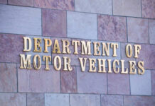 Sign for the Department of Motor Vehicles on a stone wall