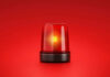 Red emergency light on red background