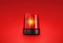 Red emergency light on red background