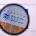 Magnifying glass focusing on the Transportation Security Administration website