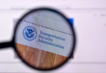 Magnifying glass focusing on the Transportation Security Administration website